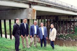 University of Nebraska researchers stand in front of bridge