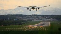 airplane lands on runway