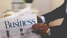 Man reading business section