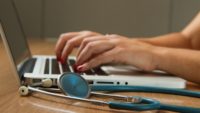 healthcare staff working on computer