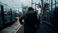 Person-walking-at-train-station.jpg