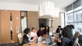 people working together at conference table 