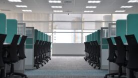 empty desk chairs in office