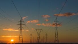 power lines in front of sunset