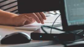 someone working at computer desk