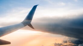 tail of plane in clouds