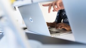 employees working at laptops