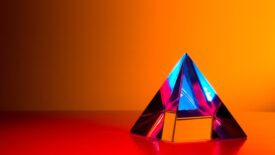 multicolor pyramid on red orange background