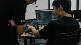 two people working at desk