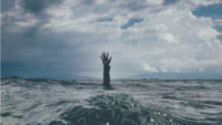 employee burnout hand reaching out of water