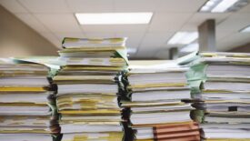 stacks of papers in folders