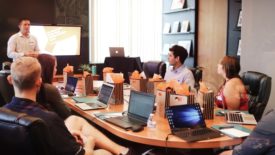 people sitting around conference table