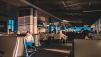 airport terminal with people waiting