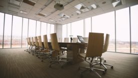 conference table next to wall of windows