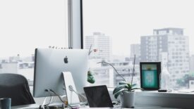 corner desk with monitor and plant