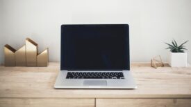 laptop on wooden desk