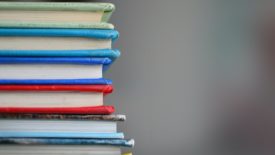colorful books stacked on top of each other