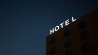 dark building with white hotel sign