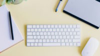 Desk with keyboard and notebook