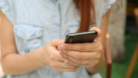 Woman holding cellphone