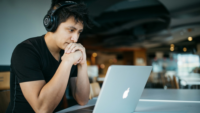 Focused man looking at laptop