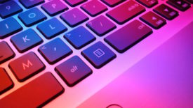 Laptop keyboard with pink and red lights
