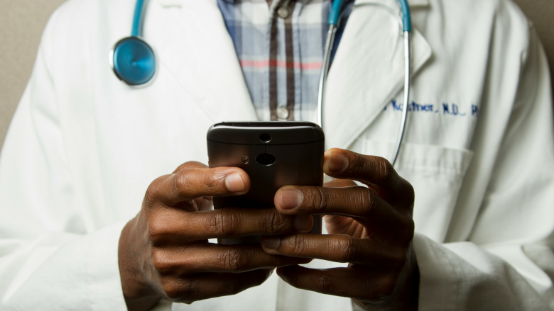 https://www.securitymagazine.com/ext/resources/2024/07/03/Doctor-holding-phone-UNSPLASH.png?1720012036