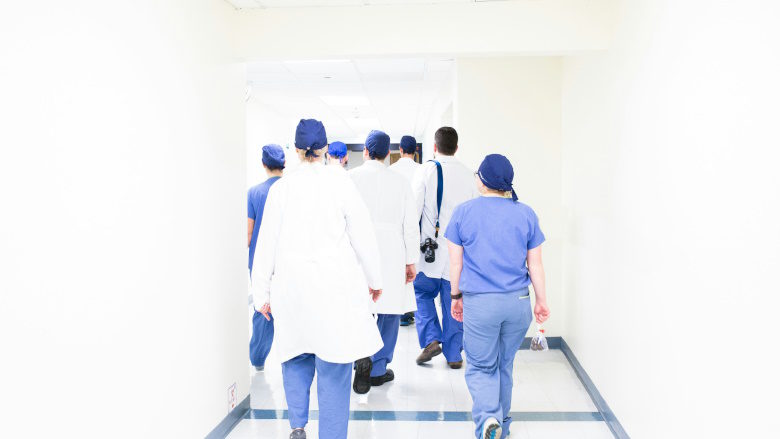 Healthcare workers walking down the hall