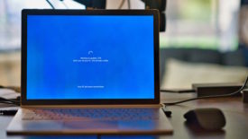 Laptop with blue screen and spinning icon