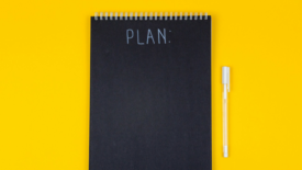 Notebook with plan written on front