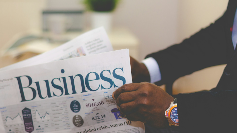 Man reading business paper