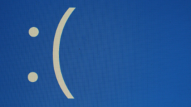 Blue screen with frowning face