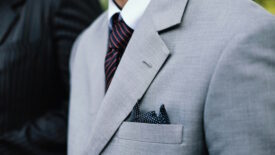 Man wearing gray suit with white shirt