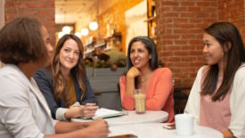 Women sitting around a conference table