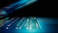 Half open laptop in blue UNSPLASH.png