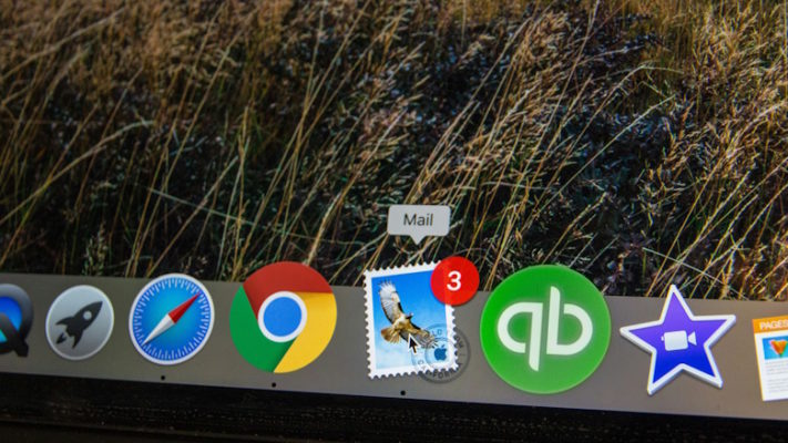 Laptop open to email icon with several notifications