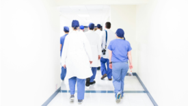 Healthcare professionals walking down hall