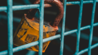 Padlock on fence