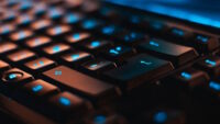 Black keyboard with blue letters