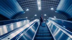 Women at top of escalator