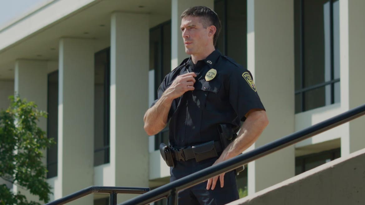 Officer placing a call over his radio